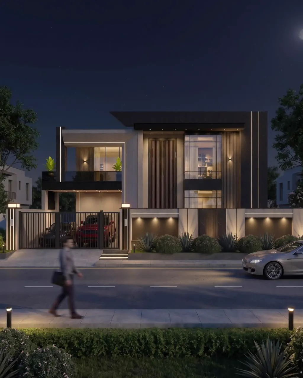Modern villa at night with warm interior lighting visible through large windows