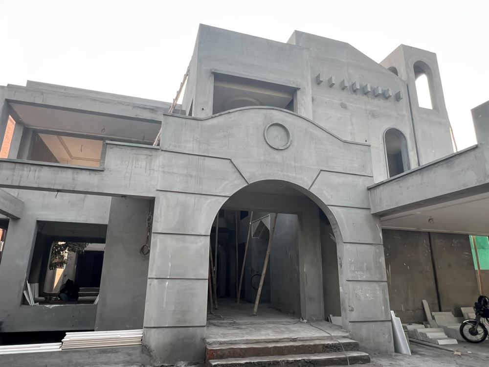 Grey structure construction site by Planet Builders & Interiors