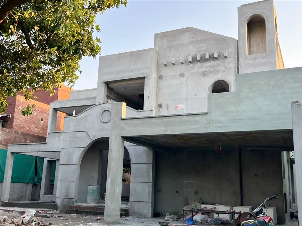 Concrete grey structure of a house in Lahore that requires proper curing