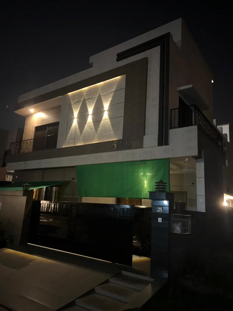 Completed modern home with facade lighting by Planet Builders